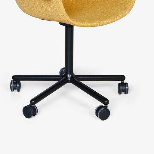מעבר לעמוד מוצר Umbeck | כיסא בריפוד אריג צהוב מושלם ורגלי פולימר גלגלים