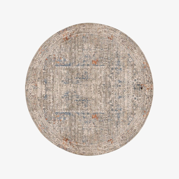 שטיח עגול מויסקוזה ופוליאסטר בגוונים של בז', כחול וטרקוטה בהדפס אתני דהוי