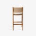 תמונה מזווית מספר 3 של המוצר MARIUERLA BAR STOOL | כיסא בר מעץ טיק מלא בשילוב ראטן בגוון בהיר