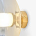תמונה מזווית מספר 3 של המוצר CORDELIA | מנורת קיר עגולה בגוון זהב ובשילוב זכוכית שקופה